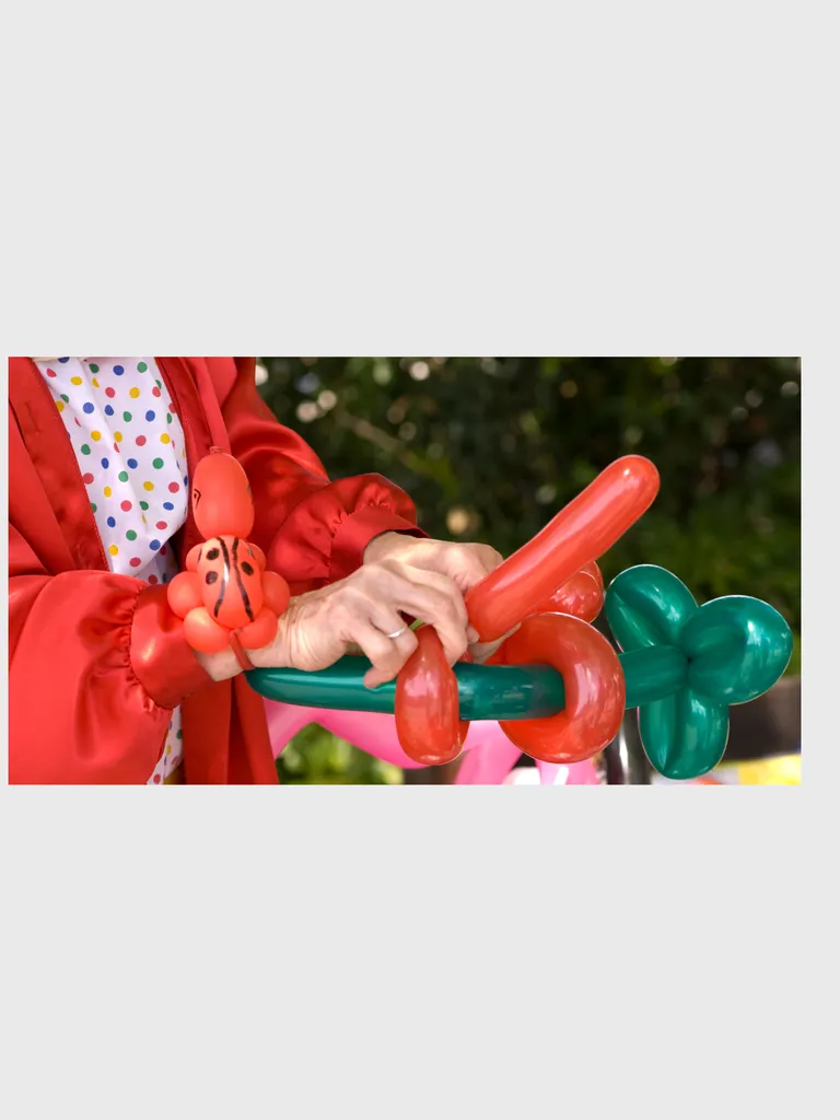 Balloon Twisting with Ginger Breadhouse the Elf